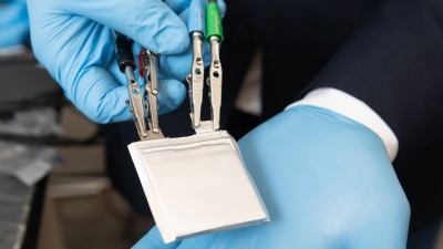 A lithium-ion battery is shown using a promising new cathode and electrolyte system that replaces expensive metals and traditional liquid electrolyte with lower cost transition metal fluorides and a solid polymer electrolyte. (Credit: Allison Carter)