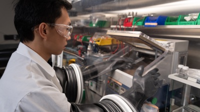 Postdoctoral researcher Congcheng Wang builds a battery cell.
