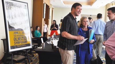 Attendees talk at the Olmsted Symposium held June 2.