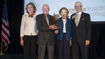 Former president and first lady Jimmy and Rosalynn Carter stand with Ivan Allen Jr.'s son, Inman Allen, right, and daughter-in-law, Tricia Allen, left.