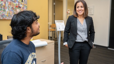 Beatriz Rodriguez with student assistant Parth Gandhi, a third-year student in the Scheller College of Business. Photo by Allison Carter.