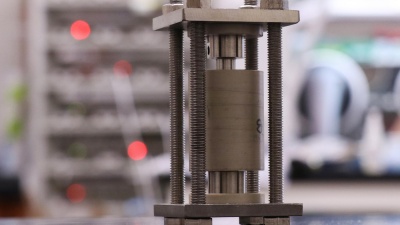 Solid-state batteries are charged and discharged in custom-made hardware designed at Georgia Tech. A smaller, modified version of the cell shown here was used to image these materials during cycling. (Credit: Matthew McDowell)