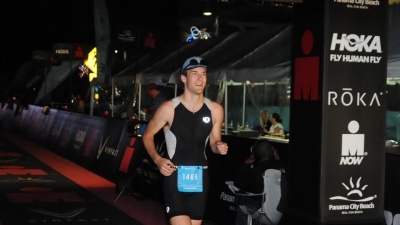 Colin Wegner crosses the finish line at the Panama City Beach Ironman Triathlon in November 2022. Submitted photo. 
