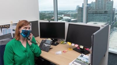 Anna Stroup-Holladay, executive assistant in the School of Computational Science and Engineering, at her desk in the Coda Building. (Photo by Rob Felt)