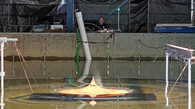 Hermann Fritz is at the controls of the volcanic tsunami generator, which simulates the effects of these natural disasters for further study.
