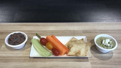 A healthy snack of hummus, vegetables, and pita chips was provided at the event. 