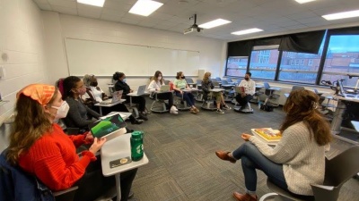 Narin Hassan (right), teaches a special topics course, Bodies and Borders: Cultural Histories and Narratives of Embodiment and Health, in the School of Literature, Media, and Communications. (Photo by Jillann Hertel)