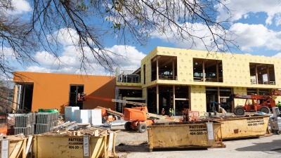 Teams working on The Kendeda Building are striving for net positive waste during construction. Seen here, materials are separated into recycling dumpsters.  
