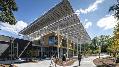 The Kendeda Building for Innovative Sustainable Design features a large "front porch" shaded by some of the hundreds of solar panels that generate electricity for the building. (Photo: Justin Chan Photography)