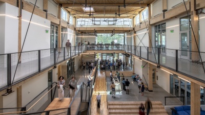 Guests attend the Friends and Family Day in September. The project incorporates reclaimed, recycled, and salvaged wood throughout the building.

Image courtesy of Justin Chan Photography.