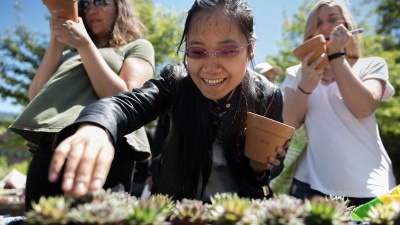 Students select succulents at a 2018 Earth Day event. Photo by Allison Carter