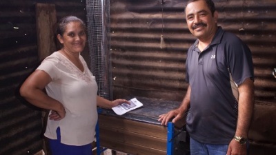 Residents of Nuevo Amanecer in Nicaragua stand with their new clean cookstove, installed in 2019. Credit: Engineers Without Borders