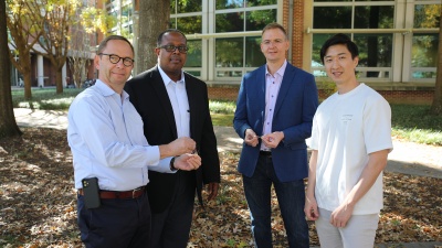 Three engineering labs at Georgia Tech collaborated to demonstrate a new level of stretchability of a photodetector. Pictured above is first author Youngrak Park (right) with the lab leads (L to R) Bernard Kippelen,  Samuel Graham, and Olivier Pierron. (Photo credit: Ben Wright, Georgia Tech)