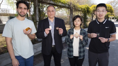 Genaro Soto Valle, Manos Tentzeris, Kexin Hu, and Yepu Cui with the fabricated proof-of-concept tile arrays and inkjet-printed tile arrays.