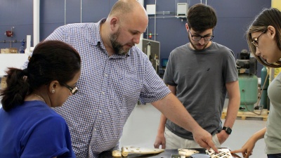 Aaron Stebner (second from left), associate professor in the College of Engineering, leads a lab session with students in the Delta Air Lines Advanced Manufacturing Pilot Facility at Georgia Tech. (Photo: Christa M. Ernst)