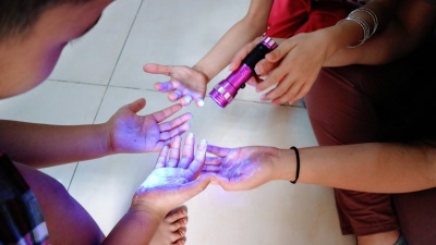 To teach the importance of hand washing, Tech students put “glo germ” lotion on a beach ball and let a group of Vietnamese children pass around the ball. By touching the ball, the children got invisible gel or “germs” on their hands, which they could only see under the black flashlight. After the children washed the germs from their hands, Tech students used the black light to show them what clean hands look like.