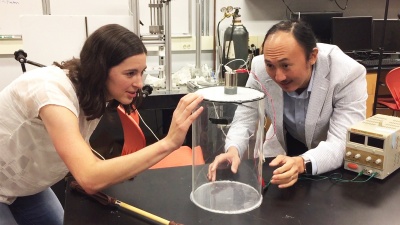 Marguerite Matherne, a mechanical engineering Ph.D. student, and Professor David Hu examine the mammal tail simulator used to study the airflow needed to keep mosquitoes from landing. (Credit: John Toon, Georgia Tech)