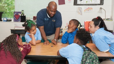 Sirocus Barnes gives instruction in an extracurricular science and technology class at Drew Charter School.