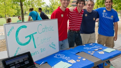 Students from the Catholic Center host an info table on Tech Walk.