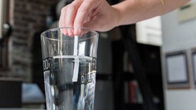 The Drinkably water-testing solution is as simple as dipping a strip into a sample of water.
