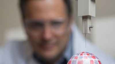 The scientists programmed the robotic arm to poke the sample with an acupuncture needle.