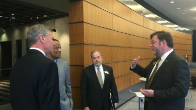 Stephen Fleming (right), vice president of Georgia Tech's Enterprise Innovation Institute, discusses the innovation ecosystem at Tech Square with Jay Williams, (second from left), the assistant secretary of commerce for economic development at the U.S. Department of Commerce. Williams, who was joined by Georgia Tech President G.P. "Bud" Peterson (left) and Steven Cross (center), executive vice president of research at Tech, visited the Institute to make an announcement about a $500,000 i6 Challenge grant th