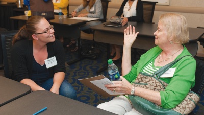 Jessica Weaver, a postdoctoral fellow in the Petit Institute for Bioengineering and Bioscience, talks with Nancy Healy, director of the National Nanotechnology Infrastructure Network Education and Outreach Office in the Institute for Electronics and Nanotechnology.