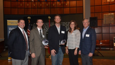 Meet Stephen Hilliard and Chris Lucas, veterans of the armed services who continue to serve their country through their roles in manufacturing. Both are the November Faces of Manufacturing, a program developed by the Georgia Manufacturing Extension Partnership (GaMEP) at Georgia Tech to honor people that work within or are affected by manufacturing in Georgia. Pictured from left to right, Tim Witter, vice president of manufacturing at JCB; Chris Lucas, fabrication manager at JCB; Stephen Hilliard, director