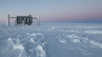 The IceCube Observatory at the Amundsen-Scott South Pole Station, in Antarctica, hosts the computers collecting raw data. Due to satellite bandwidth allocations, only certain data can be sent to the University of Wisconsin-Madison for further analysis. (Credit: Sven Lidstrom)