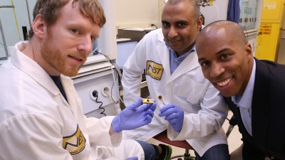 Georgia Tech researchers have developed a polymer material that can reliably conduct heat from electronic devices. Shown (l-r) are Thomas Bougher, a Ph.D. student in the George W. Woodruff School of Mechanical Engineering, Virendra Singh, a research scientist in the Woodruff School, and Baratunde Cola, an assistant professor. (Georgia Tech Photo: Candler Hobbs)
