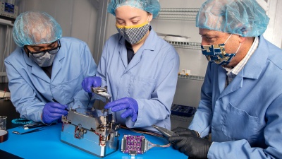 Researchers in Georgia Tech’s School of Aerospace Engineering assemble the Lunar Flashlight’s propulsion system. The project is part of a NASA mission to find frozen water on the moon. (Photo by: Candler Hobbs)