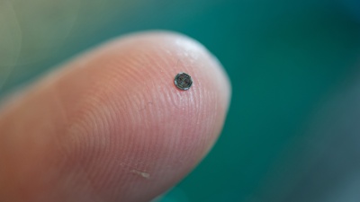 A single-chip catheter-based device that would provide forward-looking, real-time, three-dimensional imaging from inside the heart, coronary arteries and peripheral blood vessels is shown on the tip of a finger. (Georgia Tech Photo: Rob Felt)