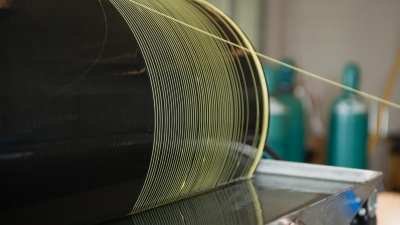 Photo shows the manufacture of polymer hollow fiber membranes, which are precursors to more advanced carbon molecular sieve hollow fiber membranes. (Credit: Rob Felt, Georgia Tech)