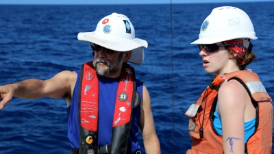 Georgia Tech Professor Joe Montoya and graduate student Sarah Weber prepare to recover equipment used to gather water samples in the Gulf of Mexico. (Credit: Ryan Sibert, University of Georgia)
