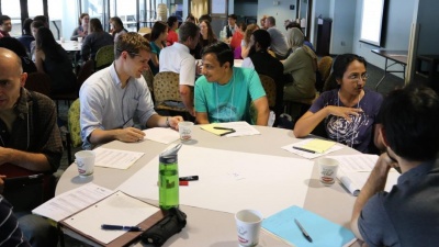 Students pair up during an activity in the 2013 INSPIRE conference, focused on equipping graduate students with new teching techniques.