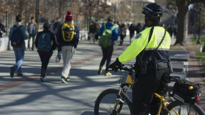 GTPD Public Safety Officer Justin Conerly maintains an attentive watch over the students on Tech Walkway between Clough Commons and the Student Center.