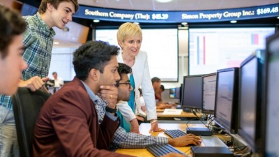 Scheller College of Business lecturer and finance expert Jacqueline Garner advises high school students on stock options at Georgia Tech's Wall Street on West Peachtree camp.