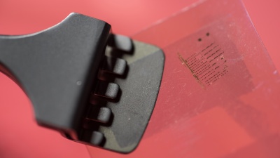 This device is part of a system under developpment by Professor Eric Vogel and two Irish research teams that uses nanoscale-thick 2-D materials, lamined onto plastic substrates, to produce disposable semiconductors for quickly diagnosing bovine respiratory disease. (Photo: Rob Felt)