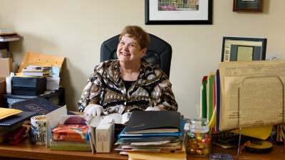 Marilyn Somers was the director of the Georgia Tech Living History Program. In this photo she is reviewing letters written from a Tech student to his parents in 1915, and the Blueprint yearbook from the same year, in her office in the Alumni House.