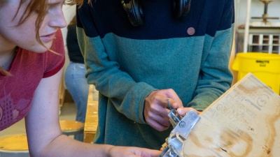 The team working in the College of Design’s woodworking space during the squirrel box-building event. Photo credit: Thomas Bordeaux, ARCH 2022.&nbsp;
