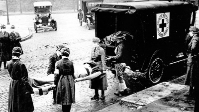 An ambulance in St. Louis, Missouri, picks up a patient believed to be infected with influenza in the 1918-19 Spanish flu pandemic, which killed 50 million people or more worldwide. Credit: National Archives