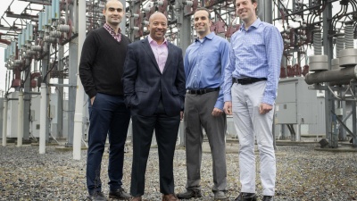 Georgia Tech researchers Tohid Shekari, Raheem Beyah, Morris Cohen, and Lukas Graber are shown with a substation that is part of the electric grid. The researchers have developed a new technique to secure the substations. (Image: Christopher Moore, Georgia Tech)