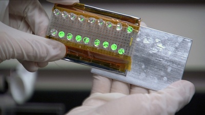 Image shows how power is generated by sliding two materials together and then creating a gap between them. This effect could be used to produce power for portable electronic devices. (Credit: Inertia Films)