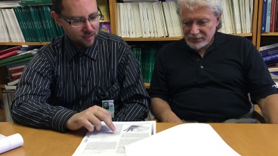 Pavel Skums (left), a regular fellow with the Centers for Disease Control and Prevention (CDC), and Leonid Bunimovich, a Regent’s Professor at the Georgia Institute of Technology, explain their new paper on Hepatitis C behavior. (Credit: John Toon)