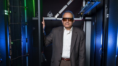 Georgia Tech’s data center simulator uses lasers, wireless sensors, and other equipment to study air flow and cooling in server racks. Shown is Yogendra Joshi, a professor in Georgia Tech’s School of Mechanical Engineering. (Credit: Rob Felt, Georgia Tech)