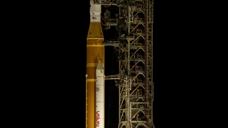 rocket on the launch pad with full moon in background 