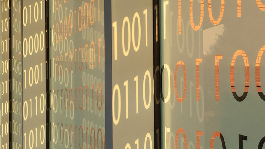 A closeup of glass panels on the College of Computing's Binary Bridge