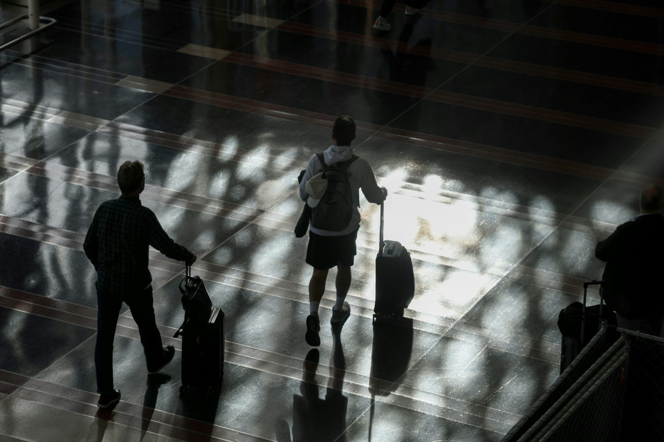 Passengers walk through the Ronald Reagan Washington National Airport on Nov. 7, 2025. Anna Moneymaker/Getty Images
