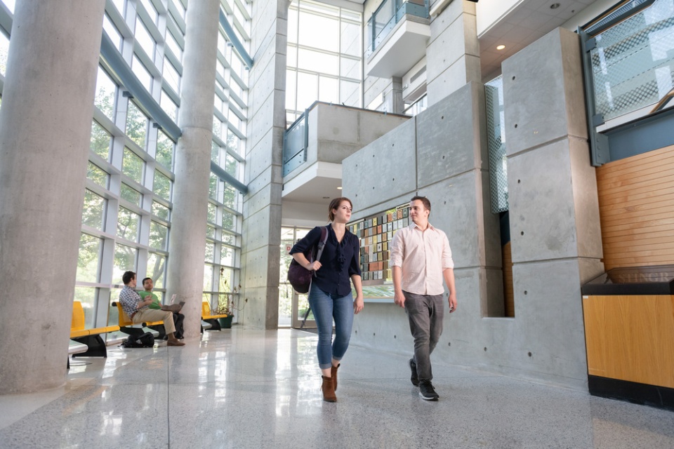Graduate students walk through the lobby of the J. Erskine Love Jr. Manufacturing Building.