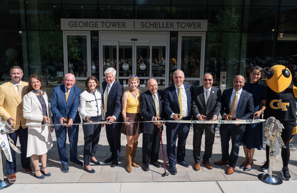 This image shows Georgia Tech and University System of Georgia leaders along with long time Georgia Tech supporters cutting the ribbon to officially open the new George and Scheller Towers at Georgia Tech
